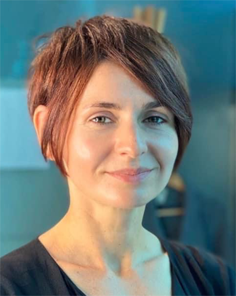 short women's pixie haircut with long bangs